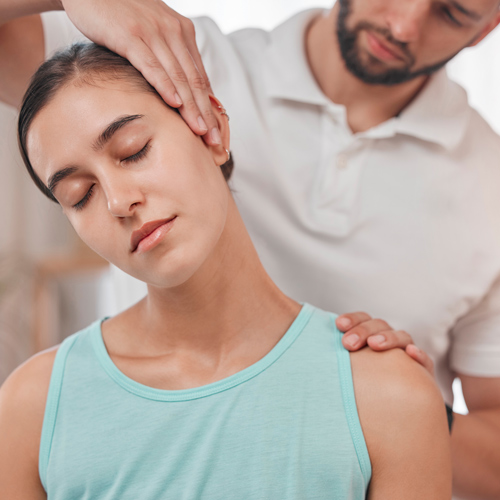 person receiving neck massage for relaxation and wellness